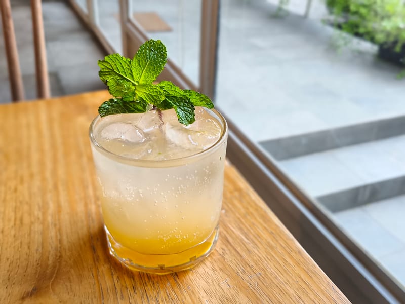 Fresh lemonade in a tall glass with mint
